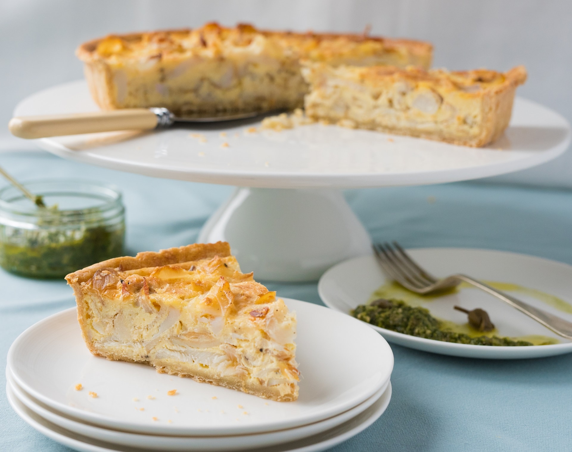 a deep filled quiche like tart with smoked haddock