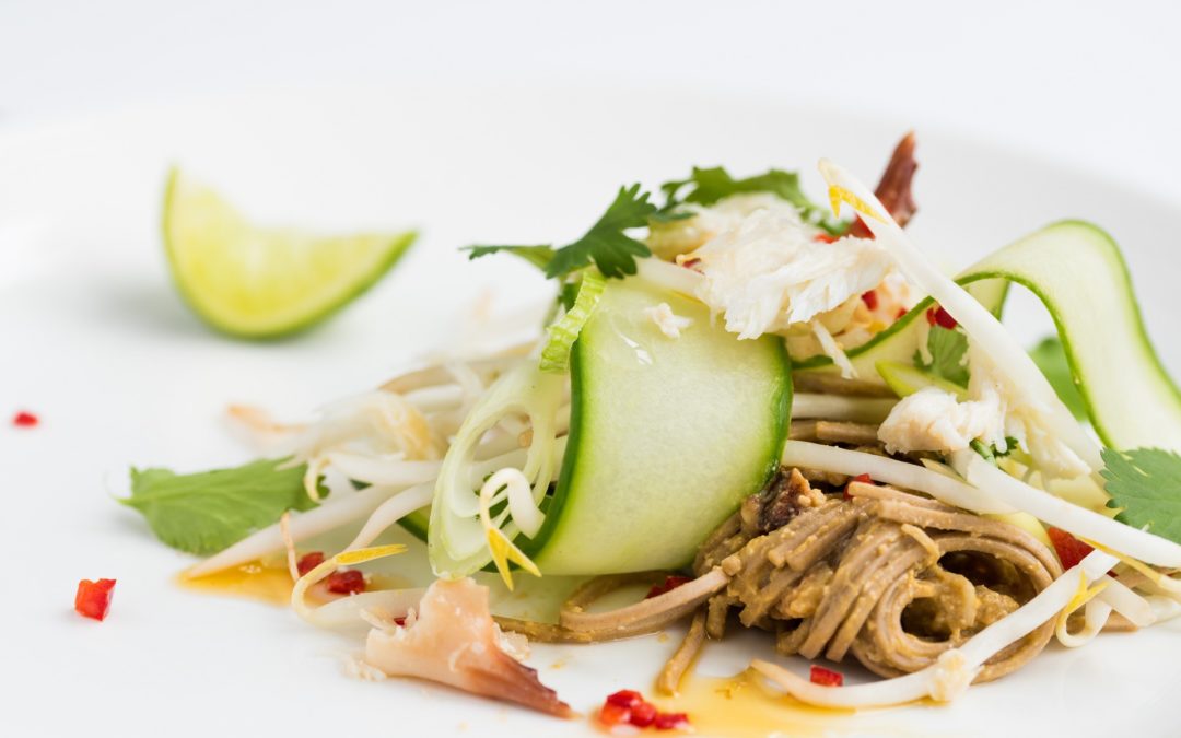 Noodles tossed with crab meat and a handful of salad of cucumber, bean sprouts, coriander leaf and sliced spring onin